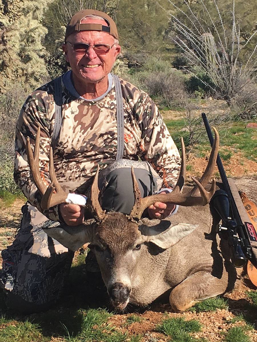 Tol Gavett of Paradise, California – the city that burned to the ground during the November 2018 Camp Fire – shows off the antlers of the buck he shot in Arizona.